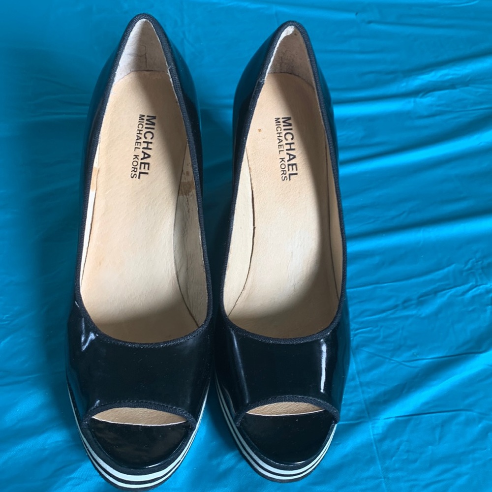 Gently worn Michael Kors Adlai’s Black and Cream Strip Wedge Shoes.